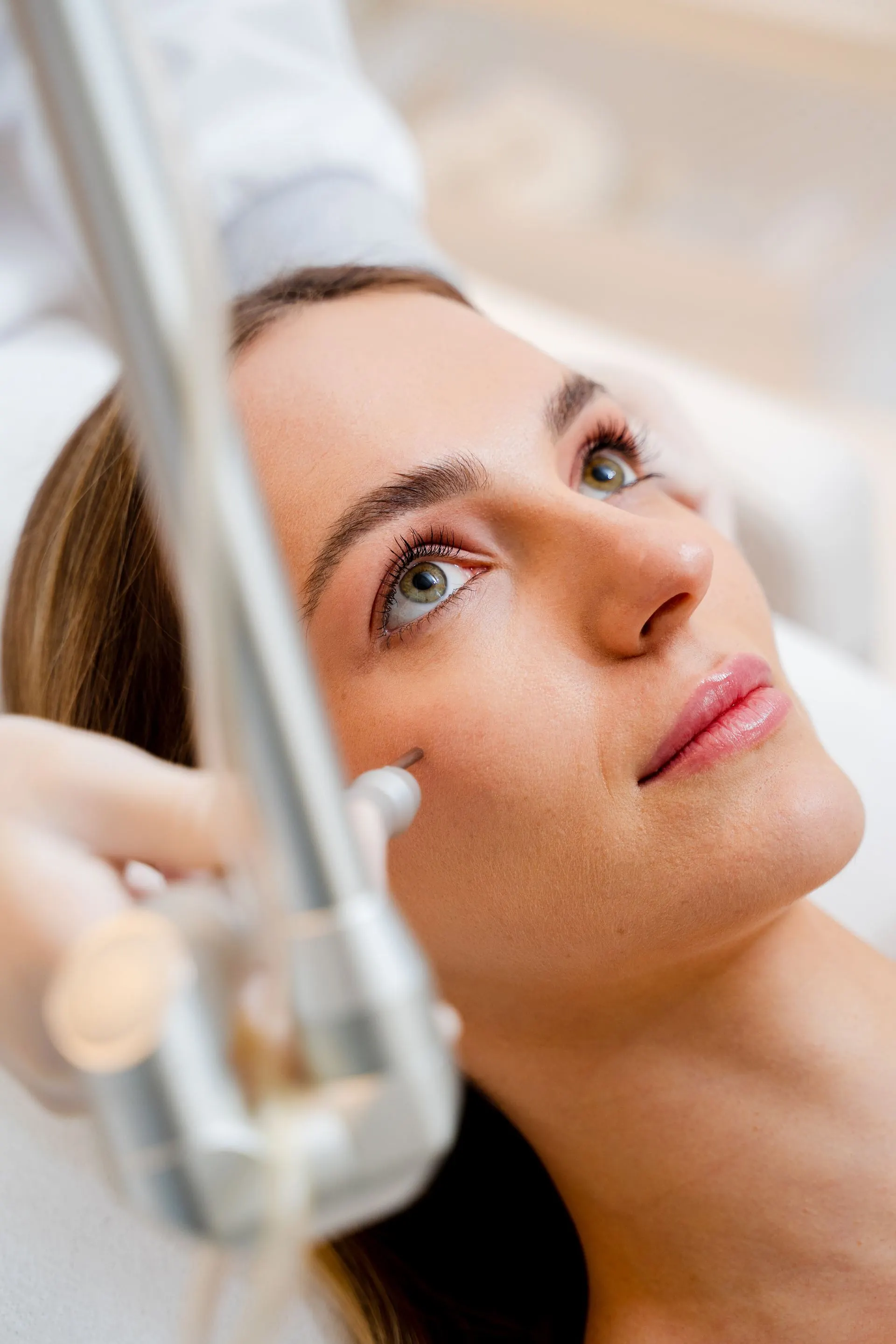 Client receiving an IPL photofacial laser treatment at New Face New Body